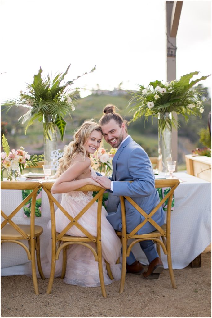 Emerald peak bride and groom sitting in chairs