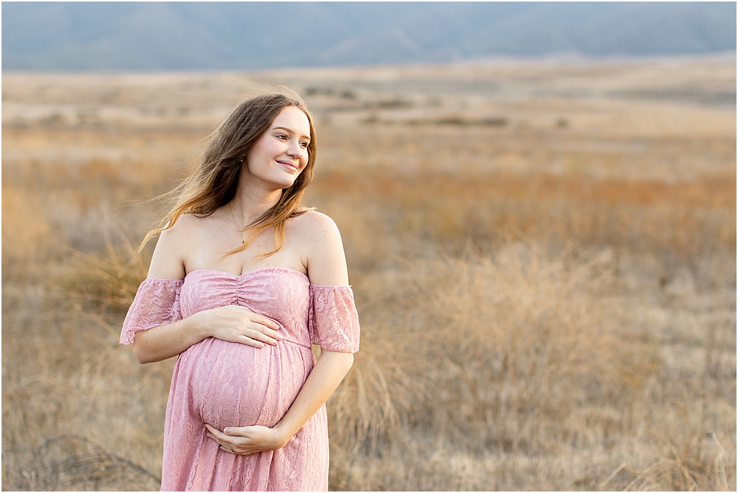 Maternity Photo Session Tips | Maternity photos, mommy-to-be in pink lace maxi dress posing in open field 
