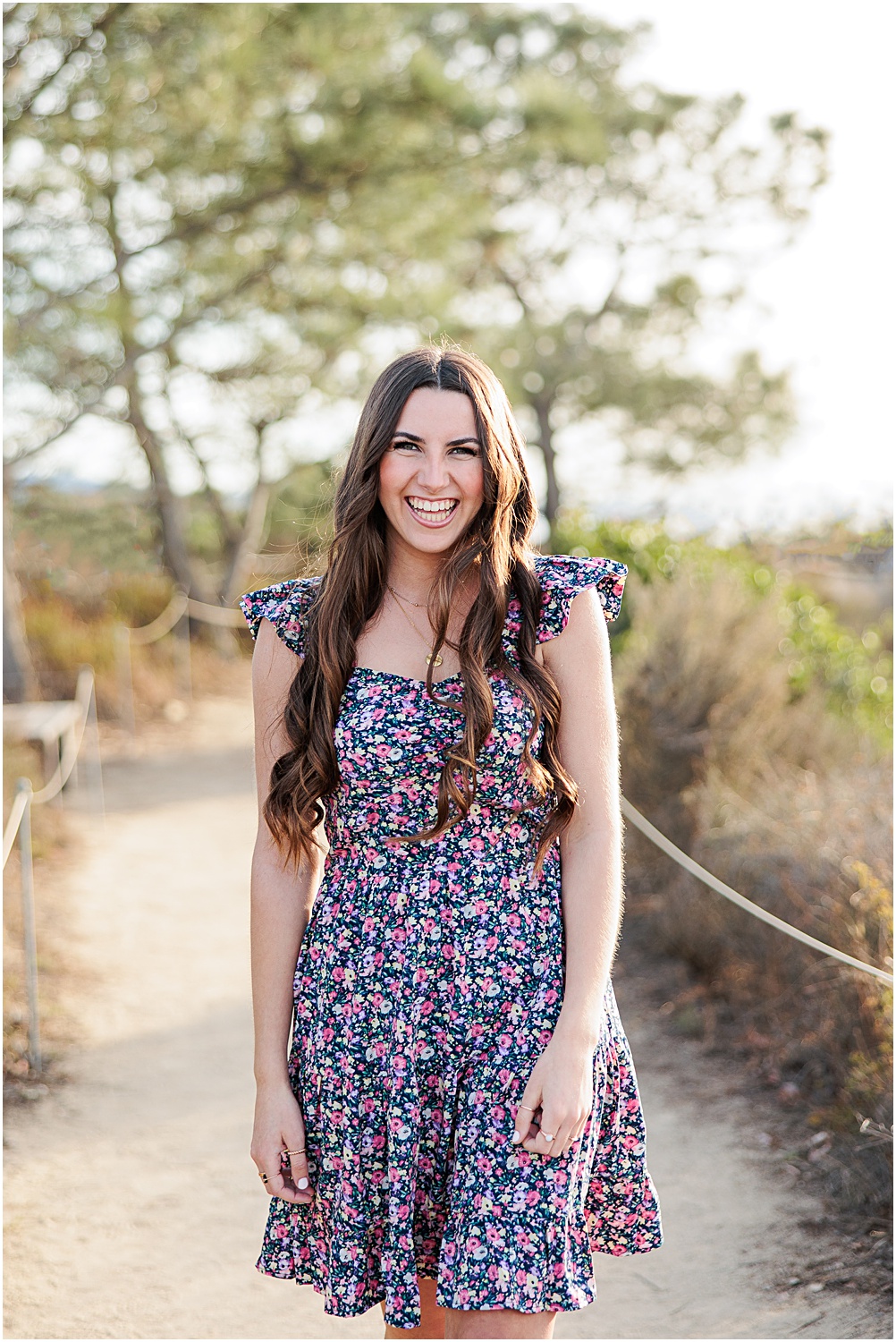 Torrey Pines State Beach Senior Photo Session | High School Senior Girl laughing in floral dress