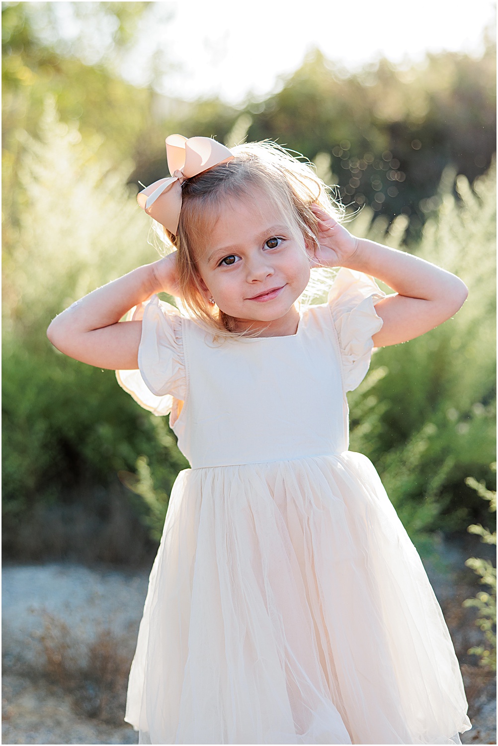 Menifee Family Photographer | Aubrey Rae | little girl posing in cream dress