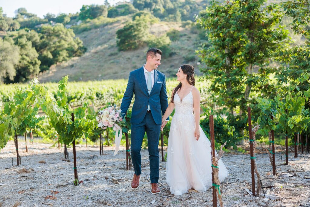 Southern California wedding photographer | Aubrey Rae | Monserate wedding venue Fallbrook, couple walking in vines