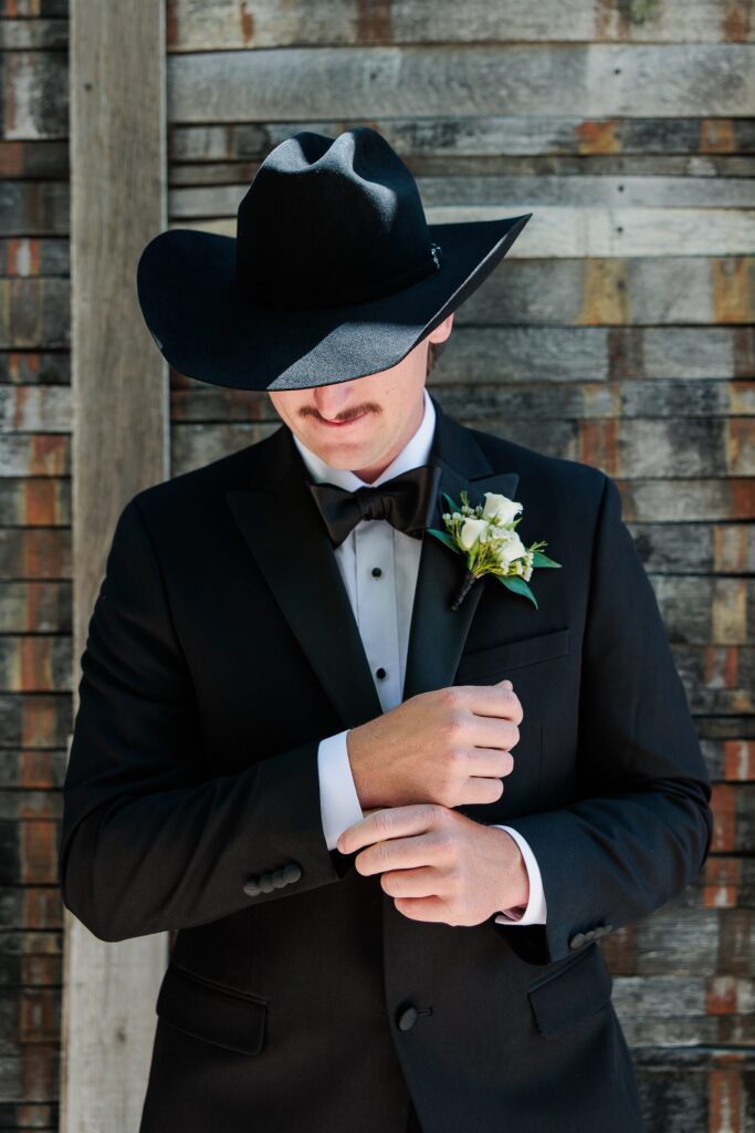 groom in cowboy hat details