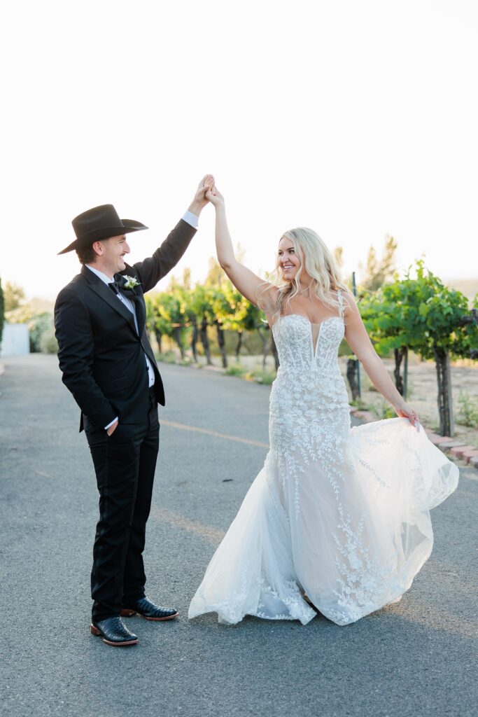 bride and groom sunset photos, groom twirling bride 
